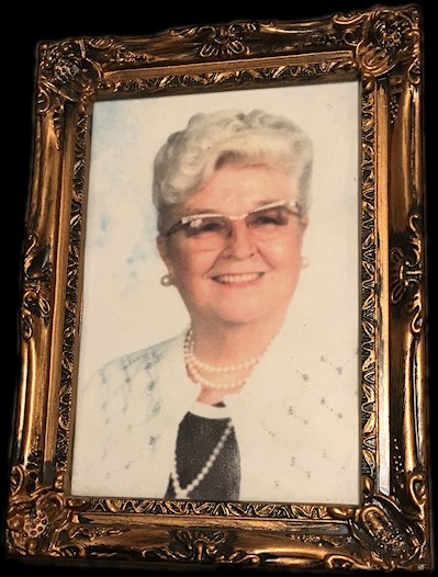 perfectly respectable hairdo,
              glasses frames, earrings, pearl necklace and smile on
              55-ish white-haired matron of morality and political
              uprightness